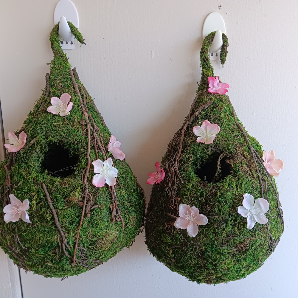 Green Hanging Birdhouses with Pink and White Flowers